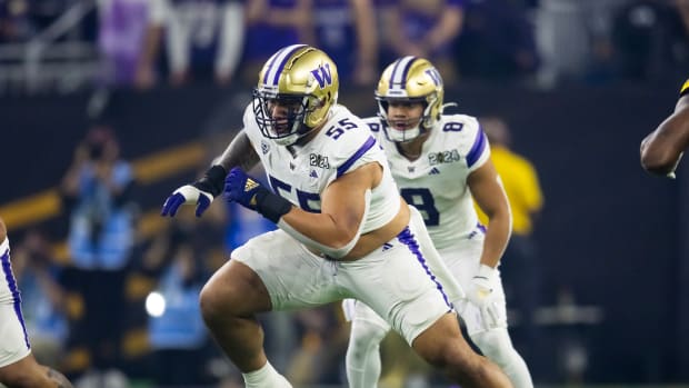 Jan 8, 2024; Houston, TX, USA; Washington Huskies offensive lineman Troy Fautanu (55) against the Michigan Wolverines during the 2024 College Football Playoff national championship game at NRG Stadium.